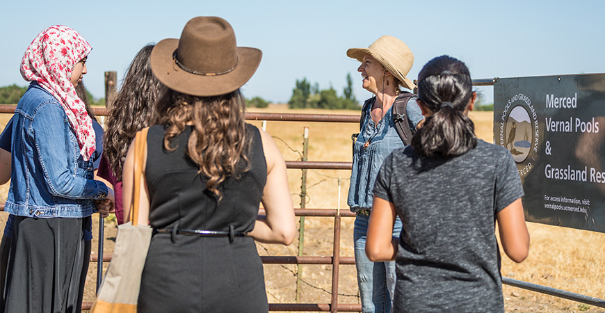 Reserve Director Monique "Mo" Kolster begins a tour of the UC Merced Vernal Pools and Grassland Reserve with high school students.