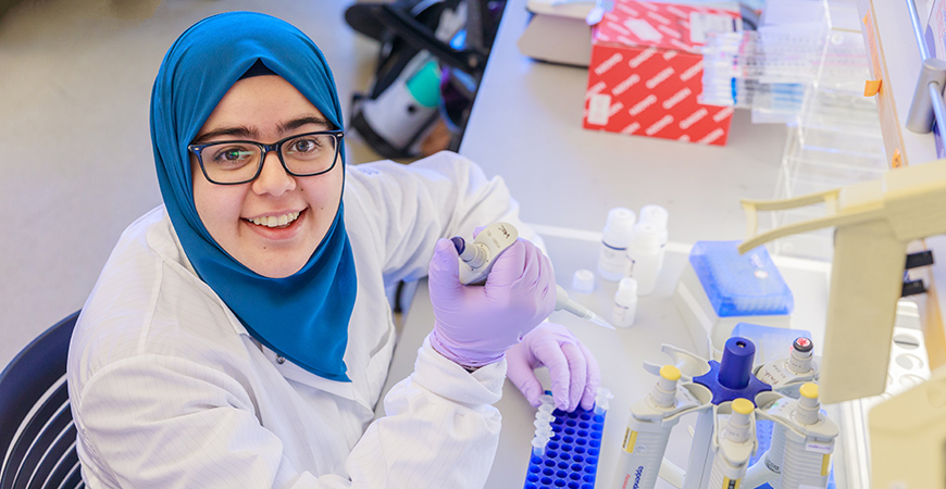 A picture of Asmaa Mohamed in a lab