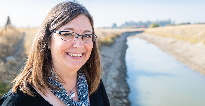 Professor Katrina Hoyer near a creek studying Valley fever