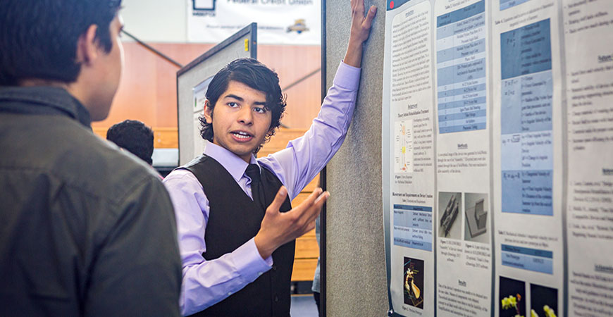 A student presenting during Research Week at UC Merced
